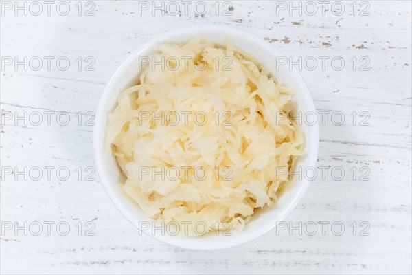 Sauerkraut white cabbage cabbage cut from top wooden board