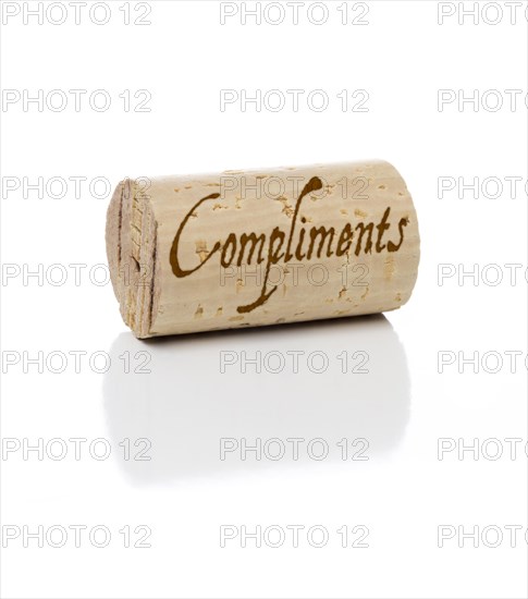 Compliments branded wine cork isolated on a white background