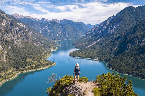 Hiker looking at Plansee