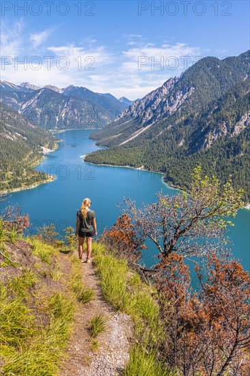 Hiker walking at Plansee