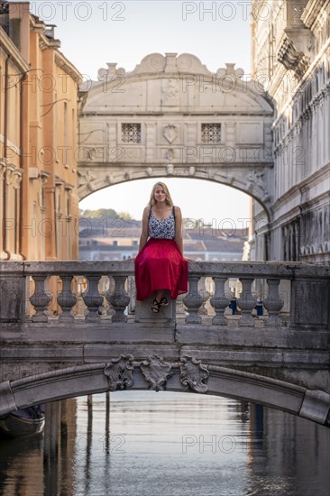 Young woman with red skirt