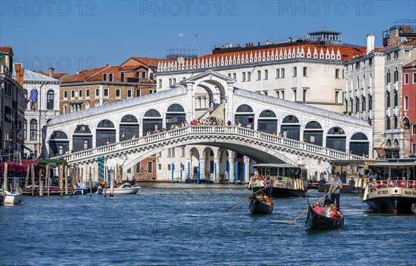 Gondola with tourists on the Grand Canal