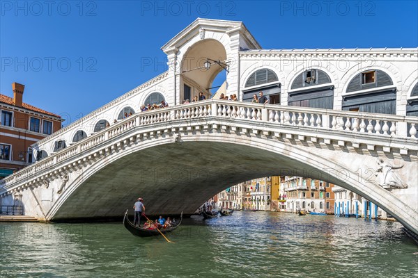 Gondola with tourists on the Grand Canal