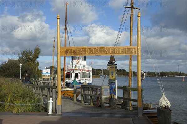 Port of Zingst with sailing boat and excursion boat