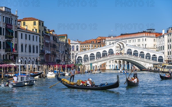 Gondola with tourists on the Grand Canal