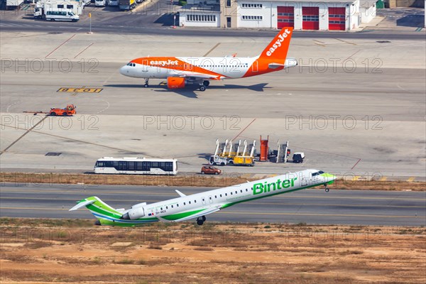 A Bombardier CRJ-1000 aircraft of Binter with registration 9H-MOX takes off from Palma de Majorca Airport