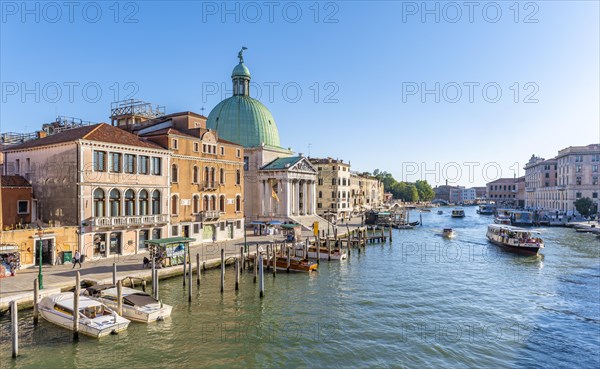 Boats on the Grand Canal with church San Simeone Piccolo at the Ponte degli Scalzi