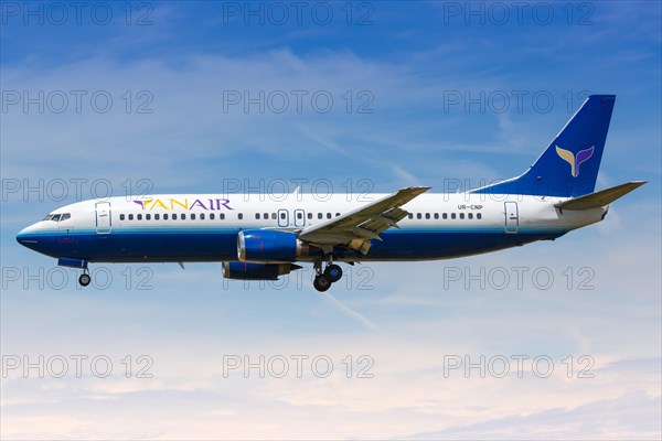 A YanAir Boeing 737-400 with the registration UR-CNP lands at Barcelona Airport