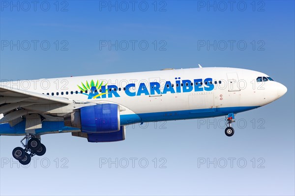 An Air Caraibes Airbus A330-200 with registration F-OFDF lands at Paris Orly airport