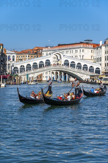 Gondola with tourists on the Grand Canal