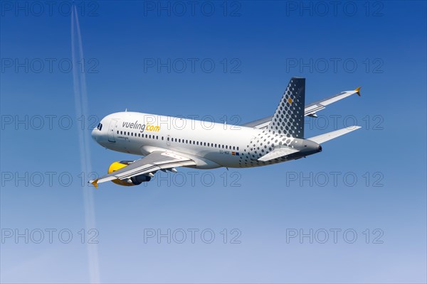 A Vueling Airbus A319 with the registration EC-MGF takes off from Barcelona Airport