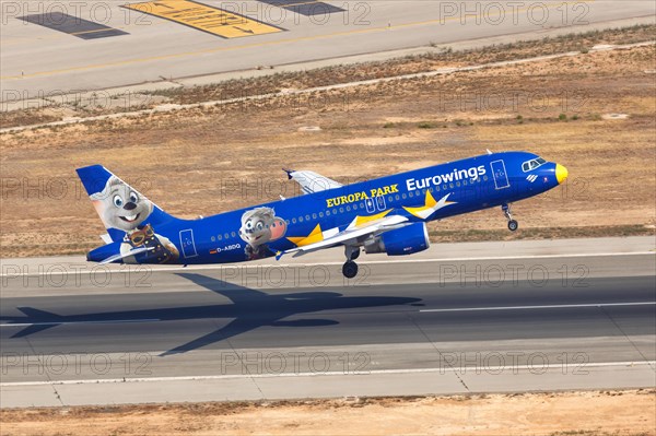 A Eurowings Airbus A320 with the registration D-ABDQ and the special livery Europa Park takes off from Palma de Majorca Airport