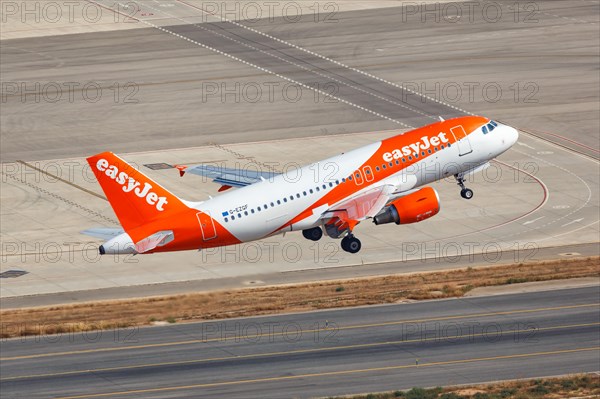 An EasyJet Airbus A319 with registration G-EZGF takes off from Palma de Majorca Airport