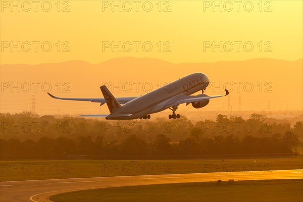 An Airbus A350-900 aircraft of Qatar Airways with registration A7-ALH takes off from Vienna Airport