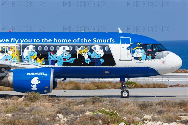 An Airbus A320 aircraft of Brussels Airlines with the registration number OO-SND with the special livery The Smurfs at Heraklion Airport