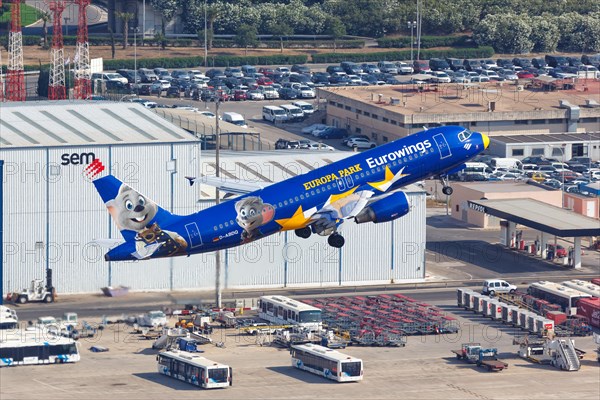 A Eurowings Airbus A320 with the registration D-ABDQ and the special livery Europa Park takes off from Palma de Majorca Airport