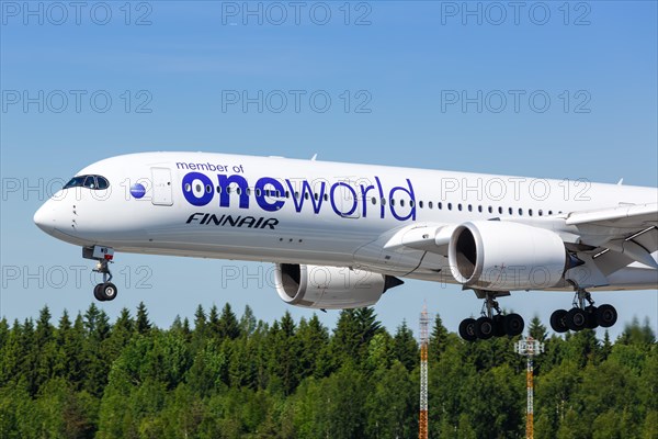 A Finnair Airbus A350-900 with the registration OH-LWB in the OneWorld special livery lands at Helsinki Airport