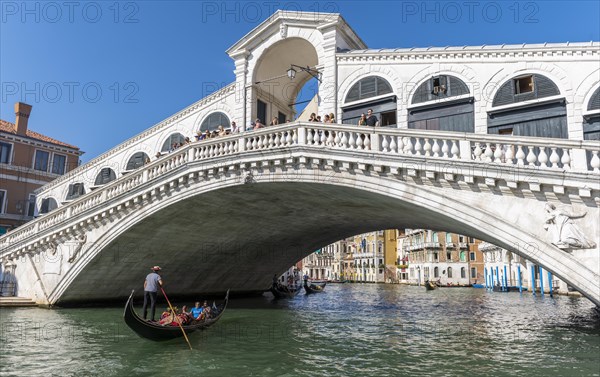 Gondola with tourists on the Grand Canal