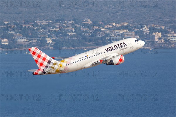 A Volotea Airbus A319 with the registration EC-MUX takes off from Palma de Majorca Airport