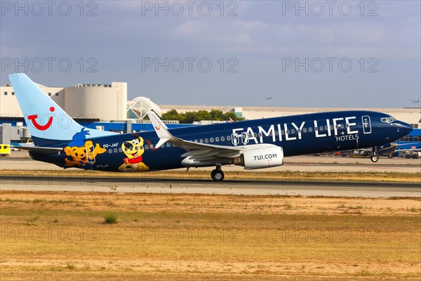 A TUI Boeing B737-800 with the registration OO-JAF and the special livery Family Life Hotels takes off from Palma de Majorca Airport