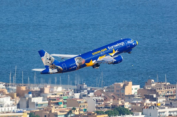 A Eurowings Airbus A320 with the registration D-ABDQ and the special livery Europa Park takes off from the airport in Palma de Majorca