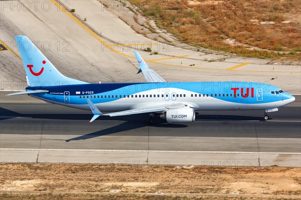 A TUI Boeing B737-800 with the registration G-FDZS takes off from the airport in Palma de Majorca