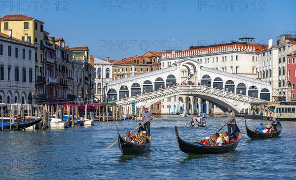 Gondola with tourists on the Grand Canal