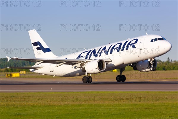 A Finnair Airbus A320 with the registration OH-LXK takes off from Helsinki Airport