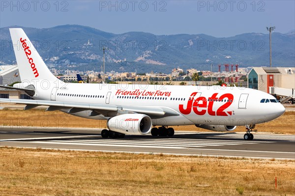 A Jet2 Airbus A330-200 with registration G-VYGL takes off from the airport in Palma de Majorca