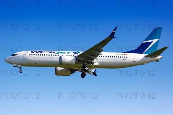 A WestJet Boeing 737-8 MAX with registration C-GXAX lands at Charles de Gaulle Airport