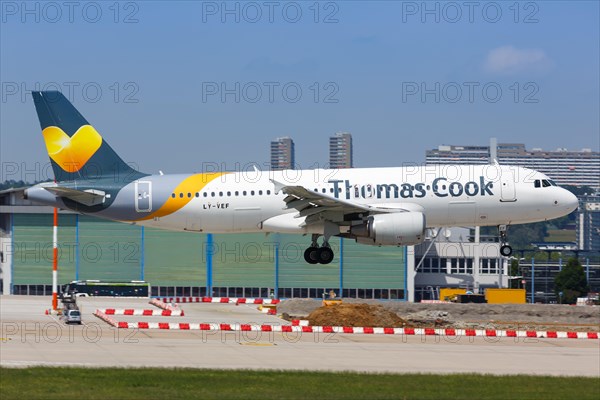 A Thomas Cook Airbus A320 with registration LY-VEF lands at Stuttgart Airport