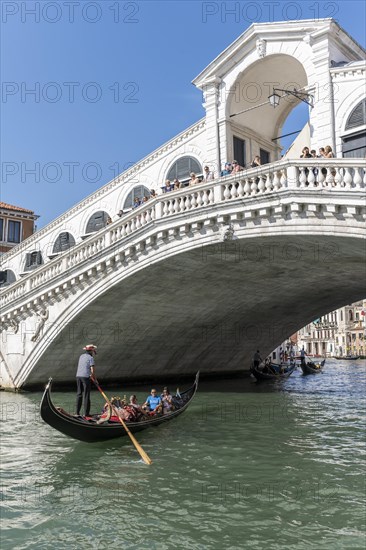 Gondola with tourists on the Grand Canal