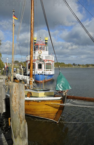 Port of Zingst with sailing boat and excursion boat