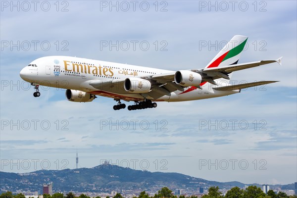 An Emirates Airbus A380-800 with registration A6-EOY lands at Barcelona Airport