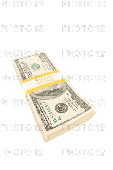 Stack of ten thousand dollar pile of one hundred dollar bills isolated on a white background