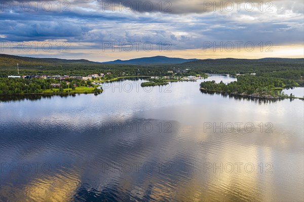 Clouds reflecting at sunset on Lake Inari