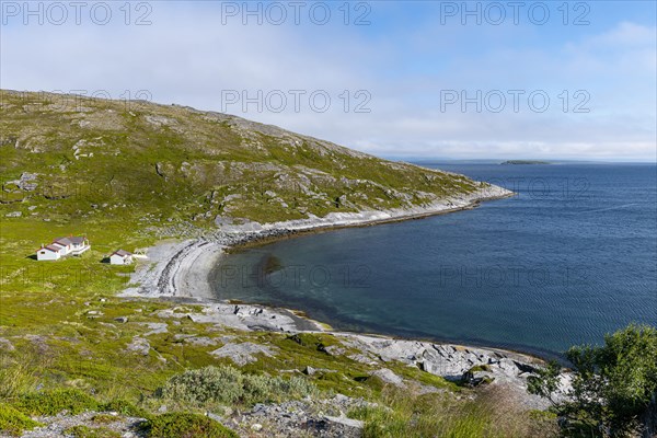 Remote little bay and settlement along the road to the Nordkapp