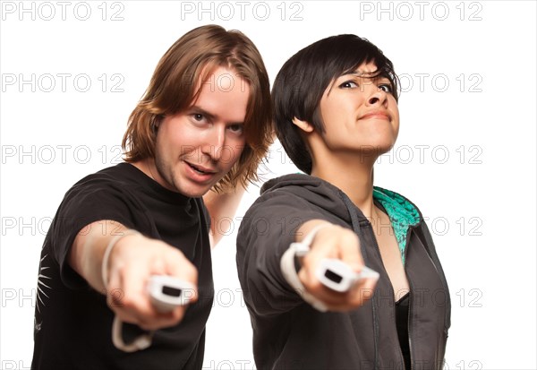 Fun happy mixed-race couple playing video game remotes isolated on a white background