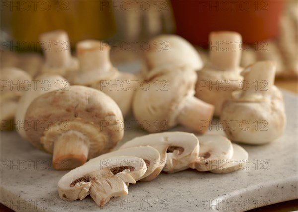 Delicious fresh sliced mushrooms on a cutting board