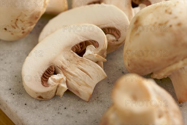 Delicious fresh sliced mushrooms on a cutting board