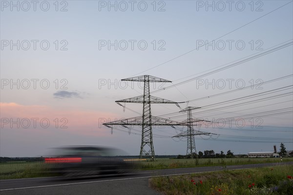 Car driving in the evening twilight