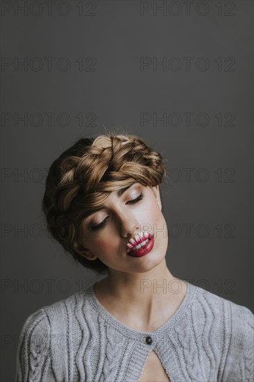 Young woman with flower lips