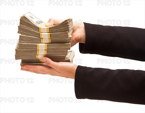 Woman handing over hundreds of dollars isolated on a white background