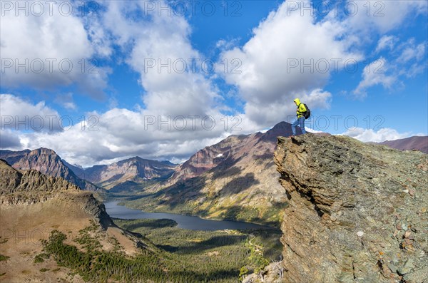 Hiker standing on rock ledge