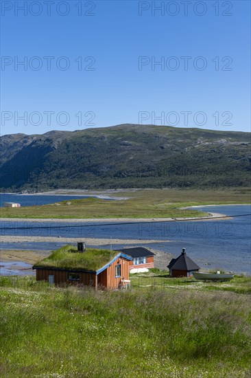 Remote little bay and settlement along the road to the Nordkapp