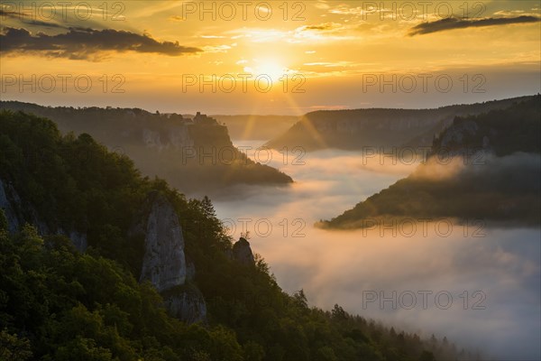 View from Eichfelsen to Werenwag Castle with morning fog