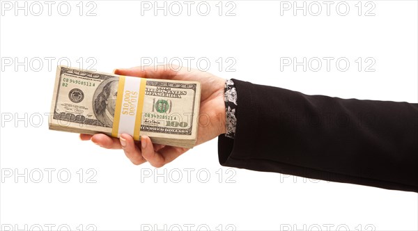 Woman handing over hundreds of dollars isolated on a white background