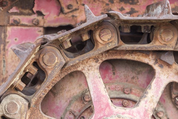 Abstract rusty vintage tractor tracks and gears