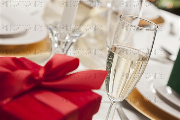 Beautiful christmas gift with place setting abstract at table