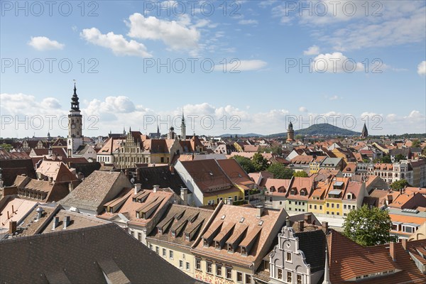 View from the church St. Peter and Paul to the old town with town hall tower and local mountain Landeskrone